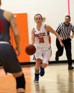 Carissa Sorenson-Anderson bring the basketball up through defensive player traffic during a game.